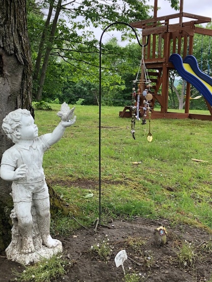 statue in back yard of cac